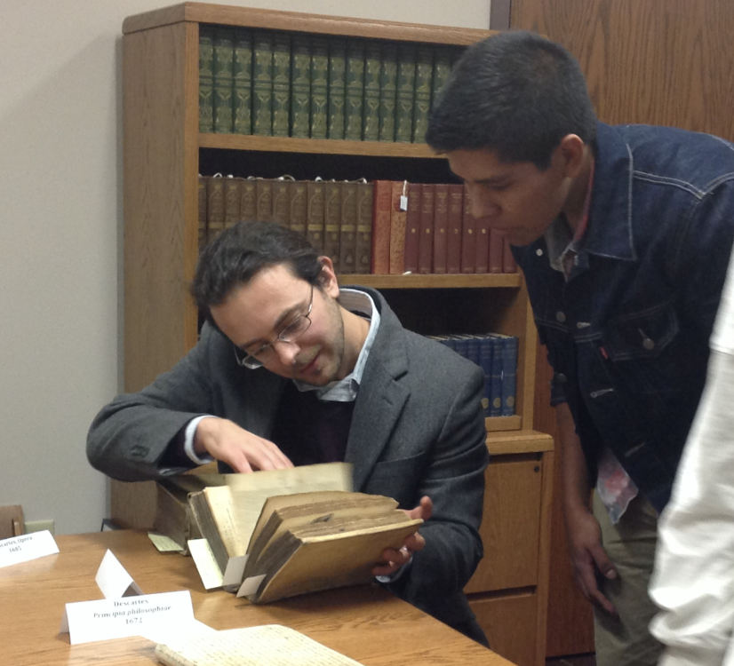 Philosophy stock image of two people looking at a book