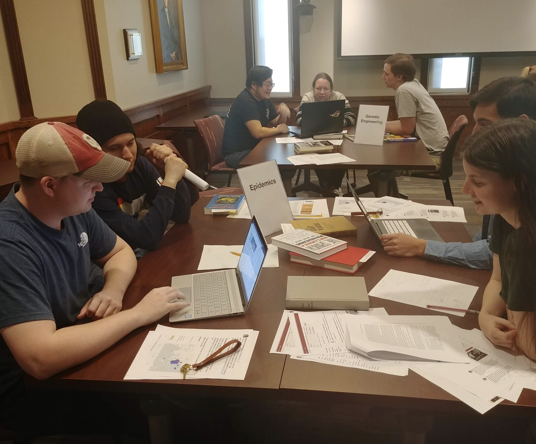 Sciences class visit students working at a table