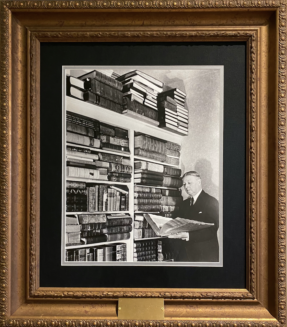 Photo of framed photograph of William Bennett Bizzell with his library