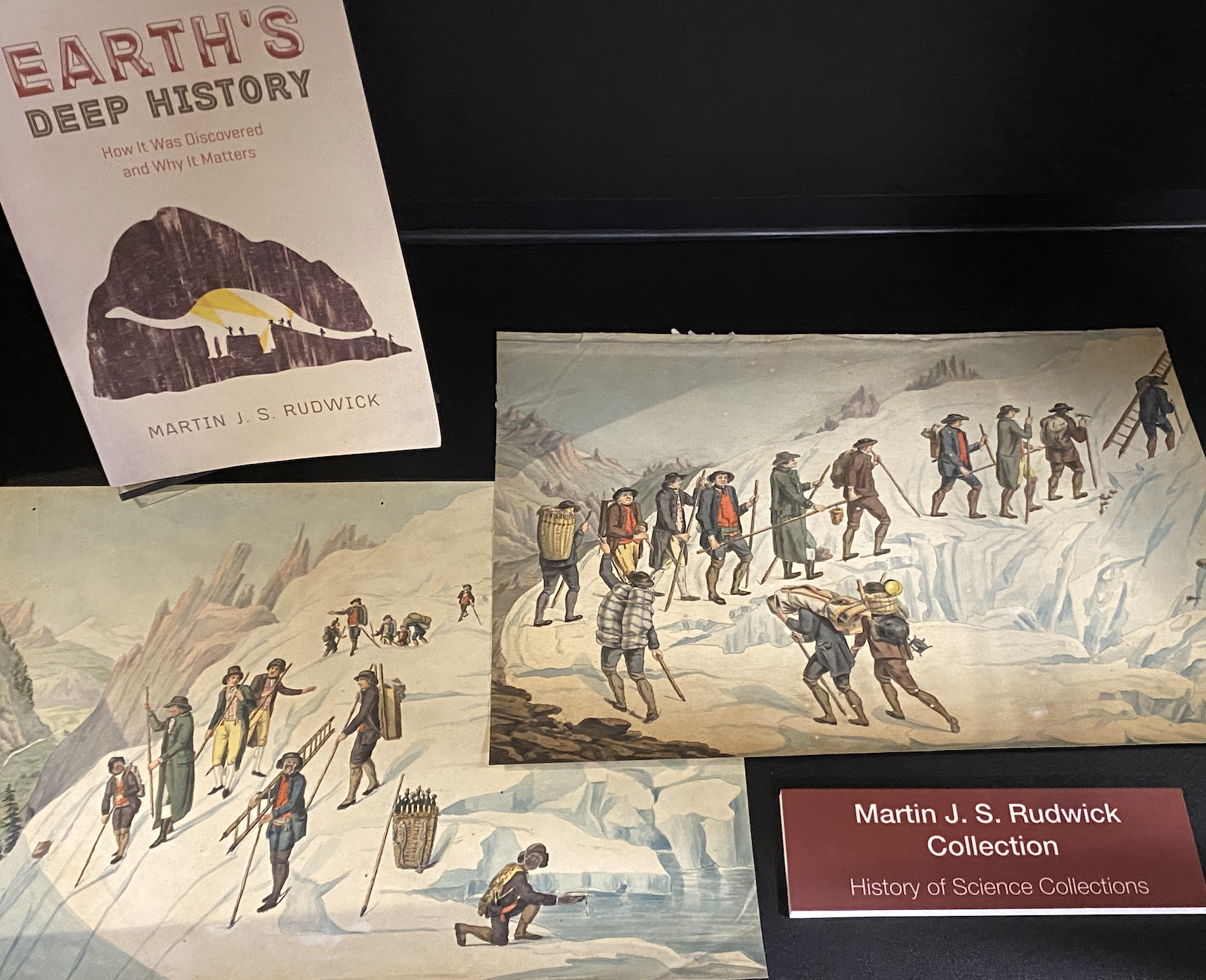 Photo of shelf with geological book and prints, part of Martin J. S. Rudwick Collection