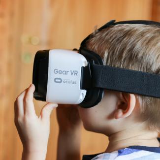 Child wearing virtual reality headset