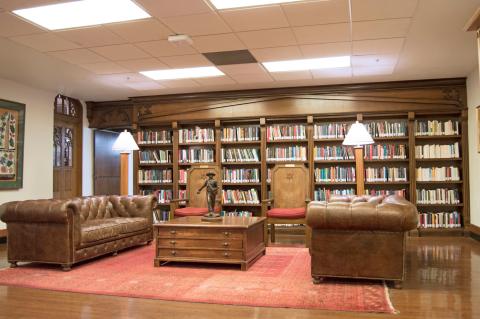 Furniture in front of shelves of books